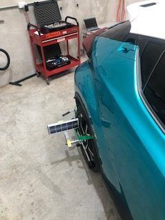 A Blue Car is Being Aligned in a Garage — Morayfield Autoglass in Caboolture South, QLD