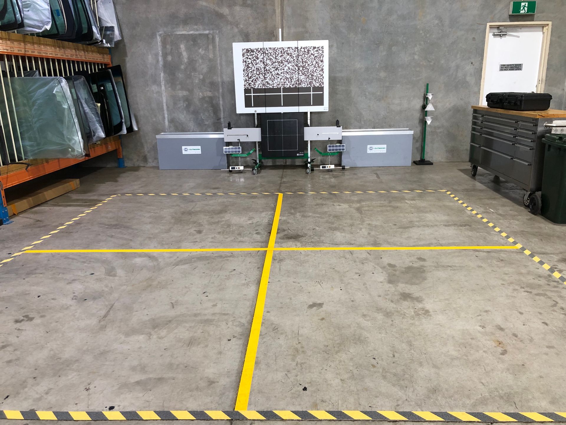 A Truck is Being Aligned in a Garage With a Machine — Morayfield Autoglass in Caboolture, QLD