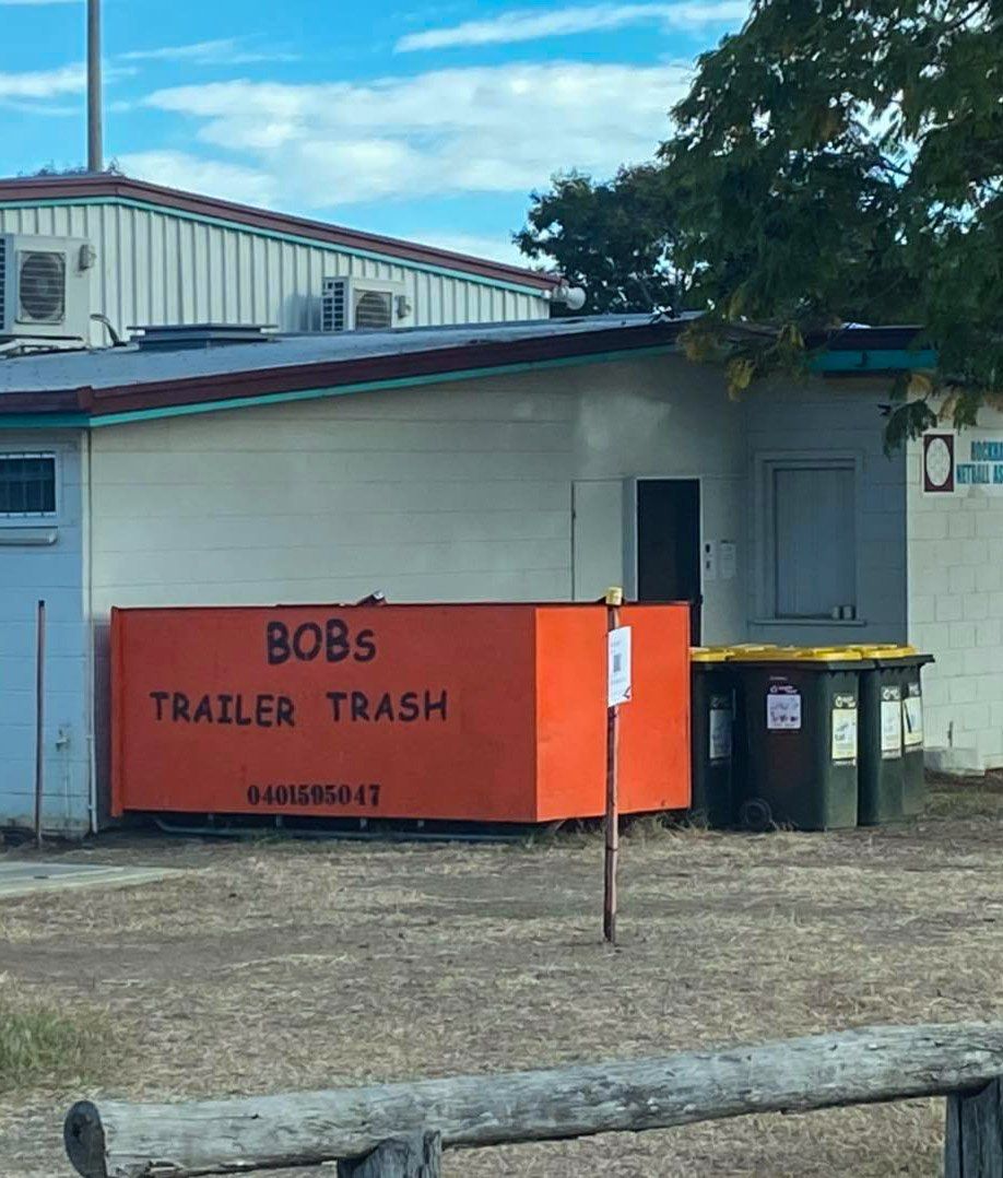 Orange Bin Beside the House — Rubbish Removal in Yeppoon, QLD