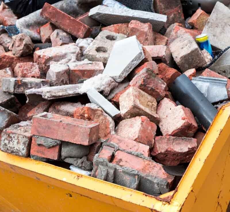 Yellow Metal Skip Full of Bricks— Rubbish Removal in Koongal, QLD
