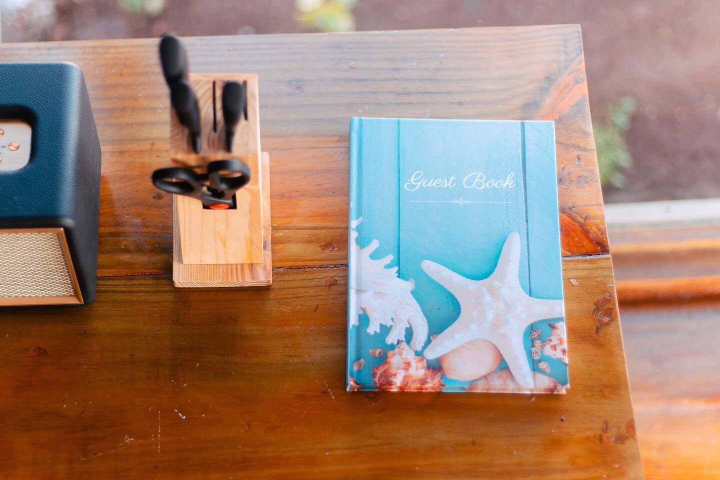 Two yoga mats are in a basket on a wooden table.