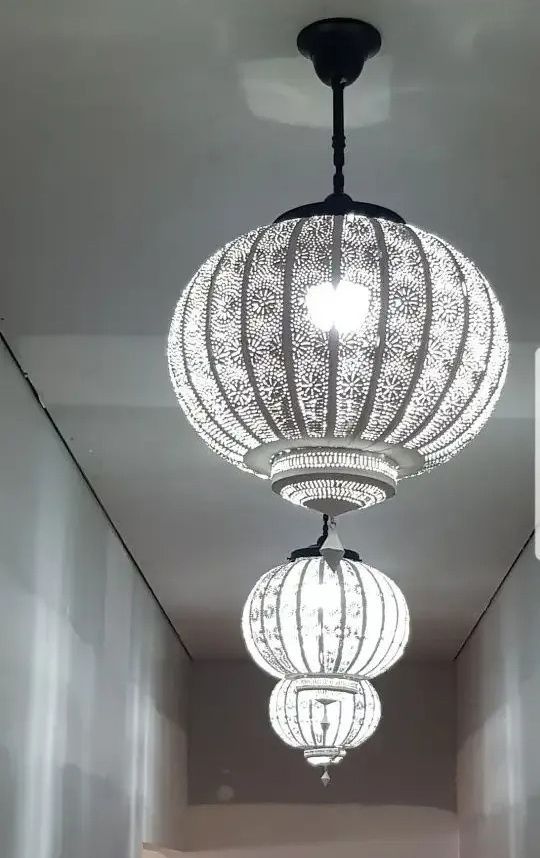 Three Lanterns Are Hanging from The Ceiling in A Hallway — Jason Jeffrey Electrical in South Tamworth, NSW