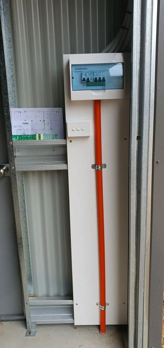 A Electrical Box Is Sitting on A Wall Next to A Door — Jason Jeffrey Electrical in South Tamworth, NSW