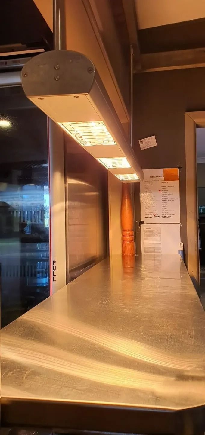A Long Counter in A Restaurant with A Lot of Lights on It — Jason Jeffrey Electrical in South Tamworth, NSW