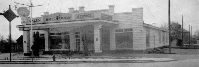 A black and white photo of the Smith Bros Building