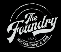 the foundry restaurant and bar logo is white on a black background