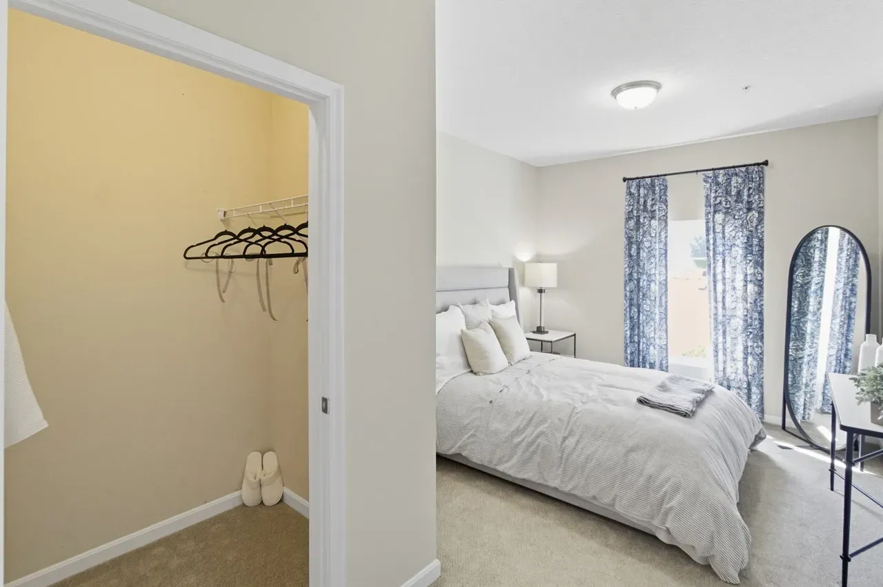 Bedroom with a closet and a bed.