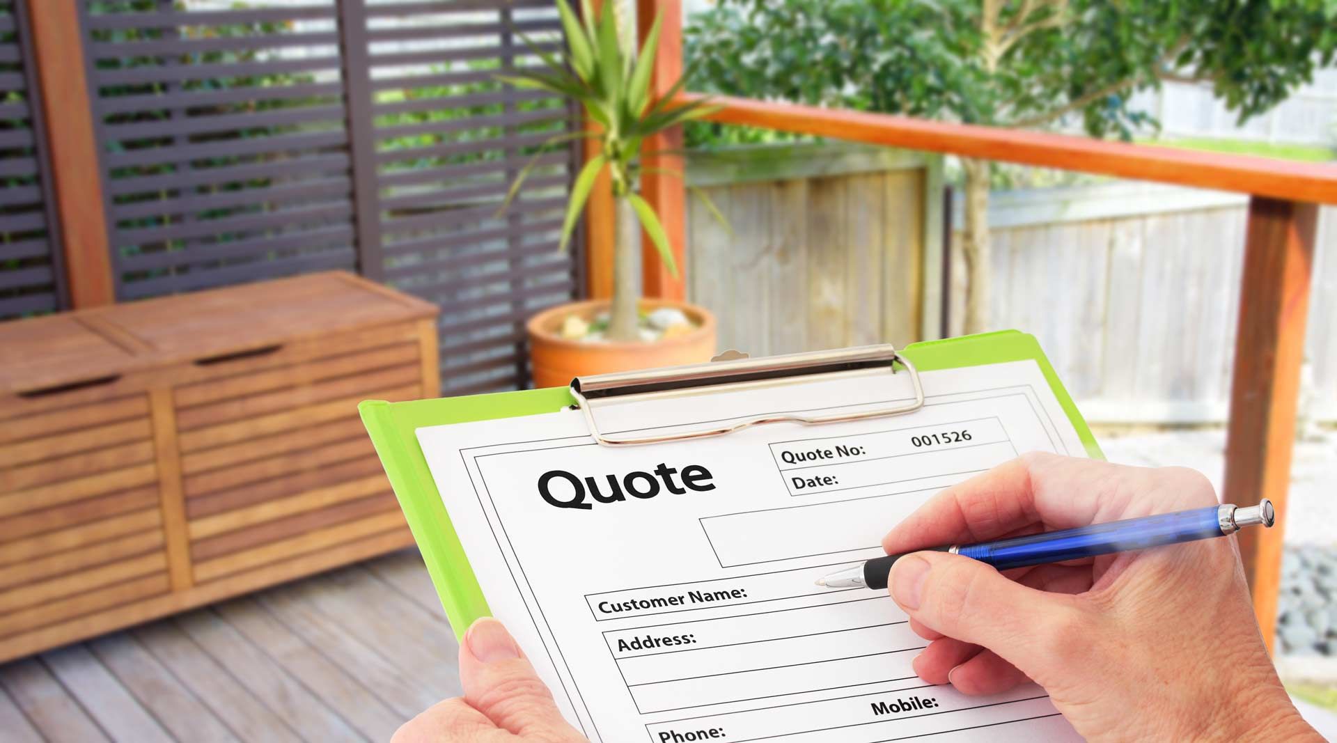 Person writing quote on clipboard