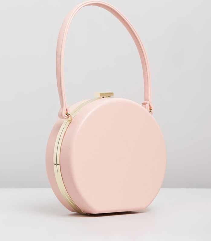 circular pink hand bag
