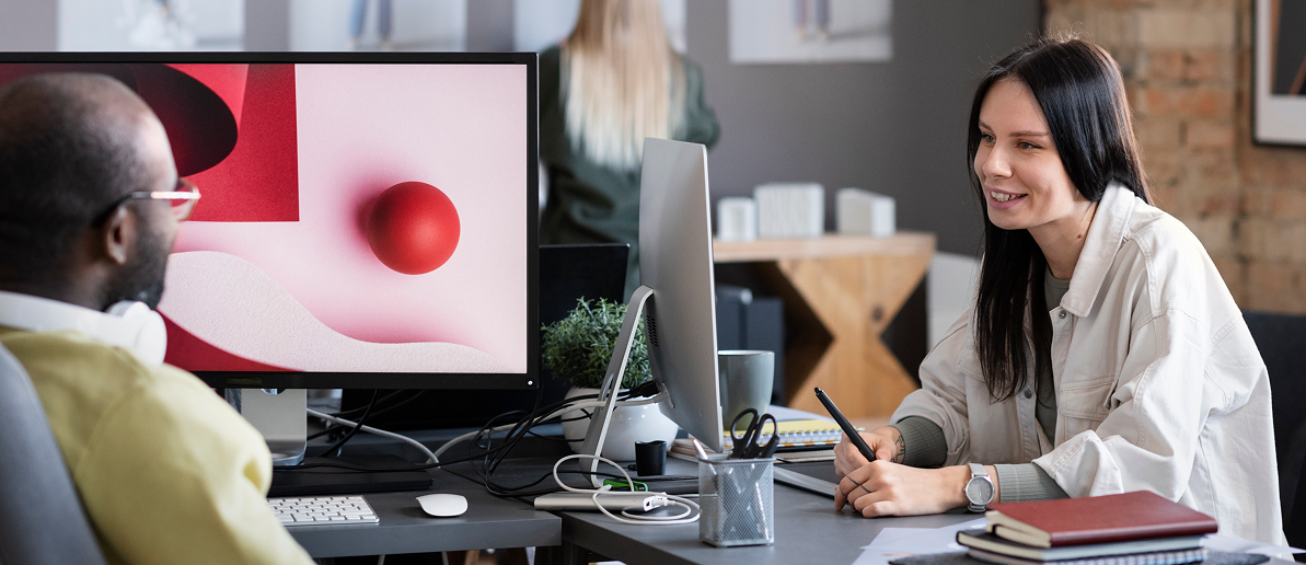 Woman's finger pointing towards a screen with floating headshots of various people.