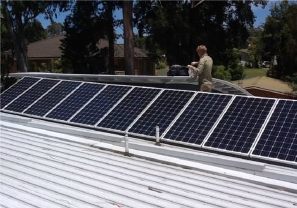 man checking the solar panel