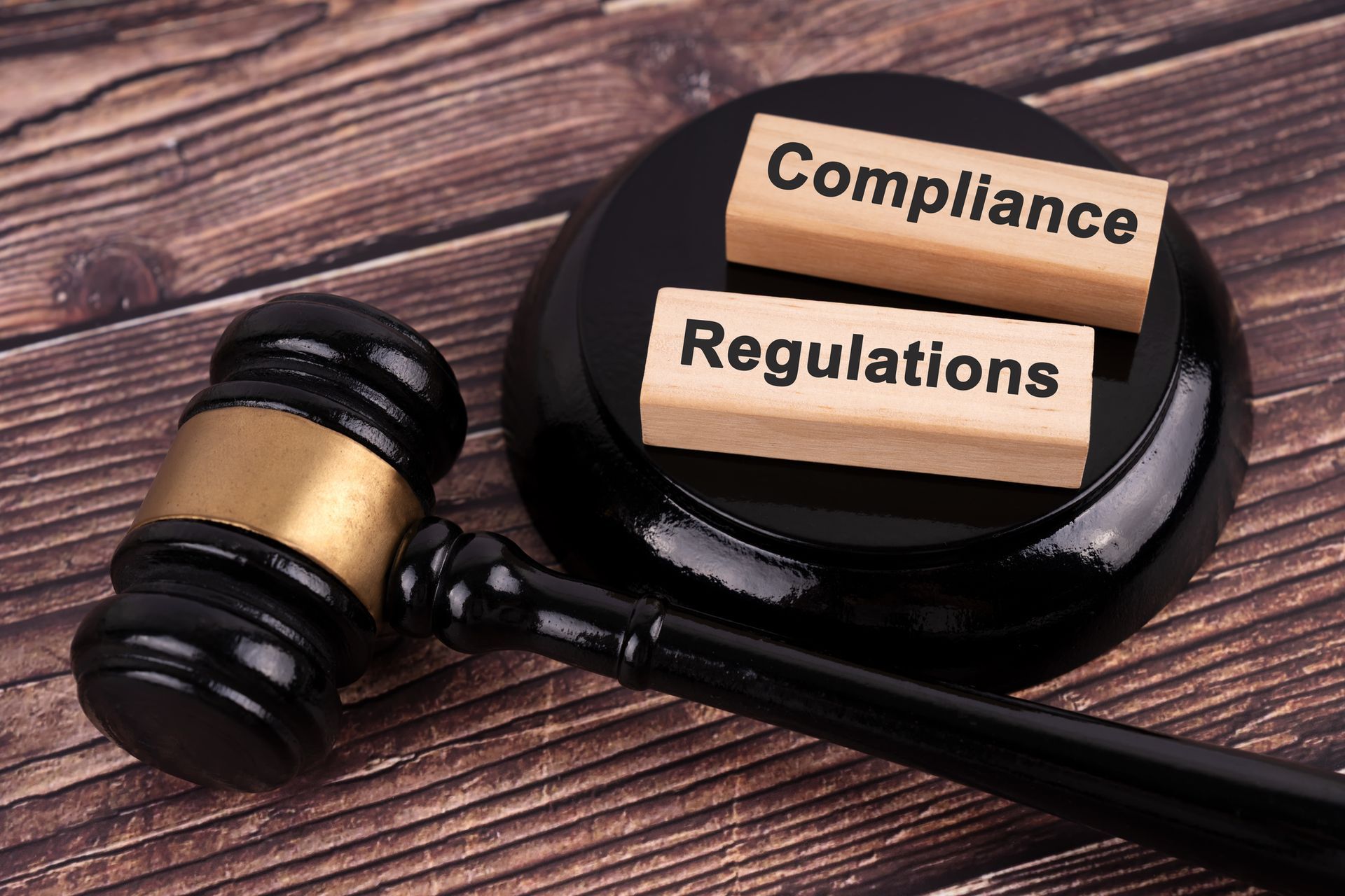 Gavel with wooden blocks labeled