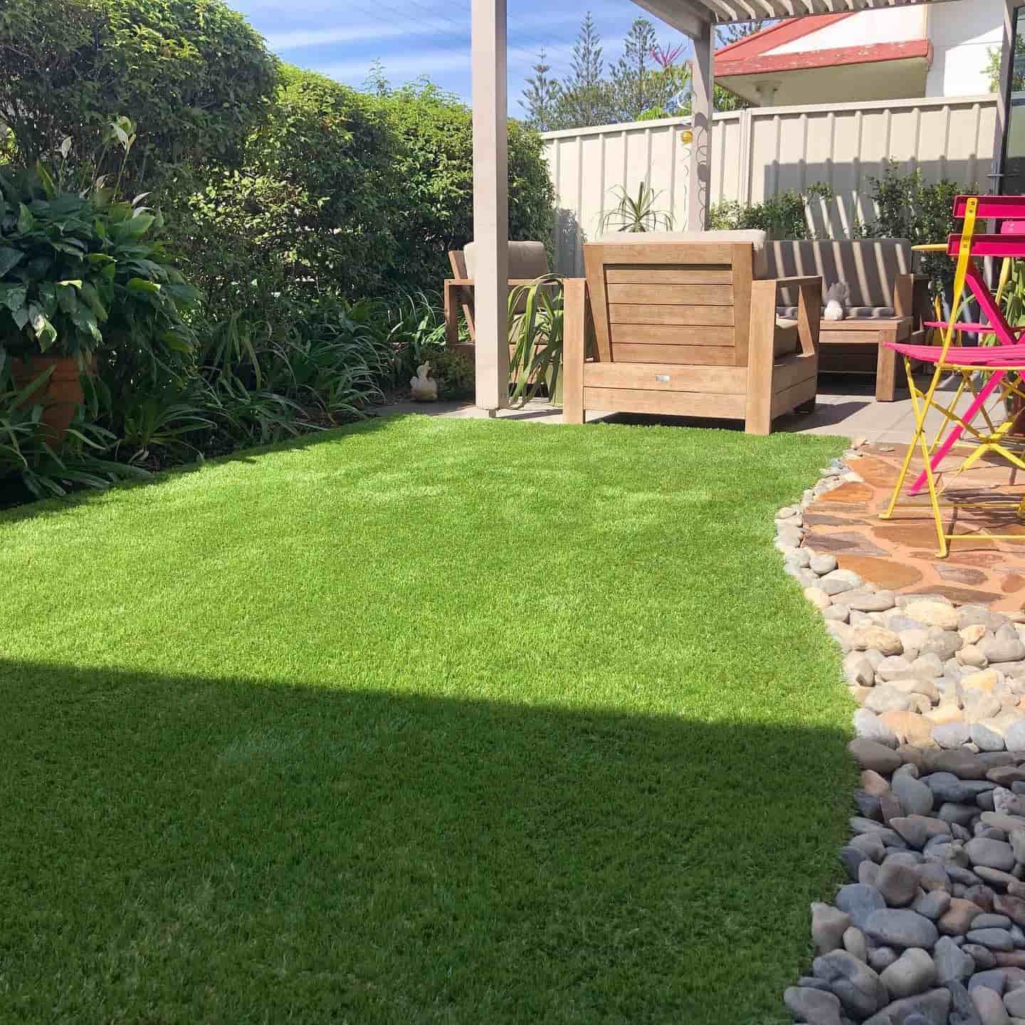Outdoor Area with Turf and Stones Walkway — D-Scapes Landscaping Services Pty Ltd in Forster, NSW