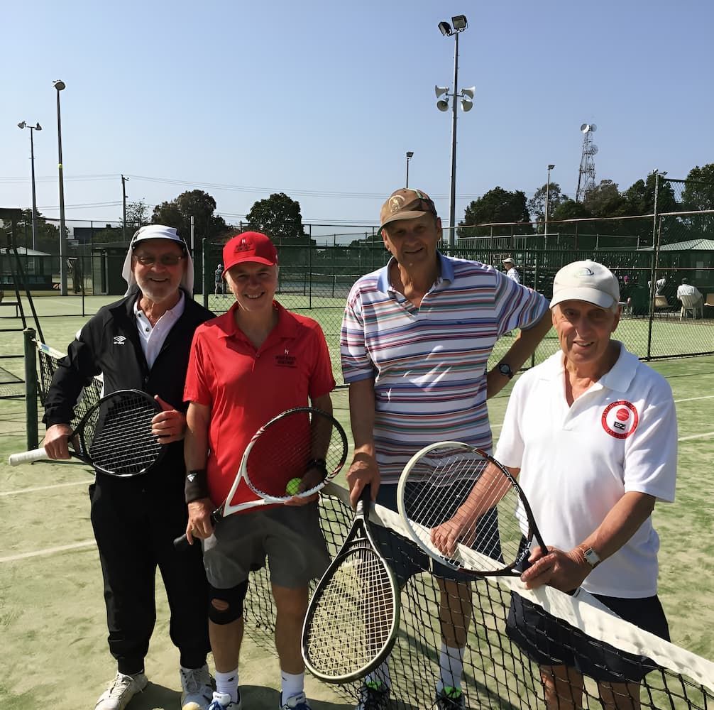A Group of Men Holding Tennis Rackets on a Tennis Court — Topspin Tennis Newcastle in Lambton, NSW