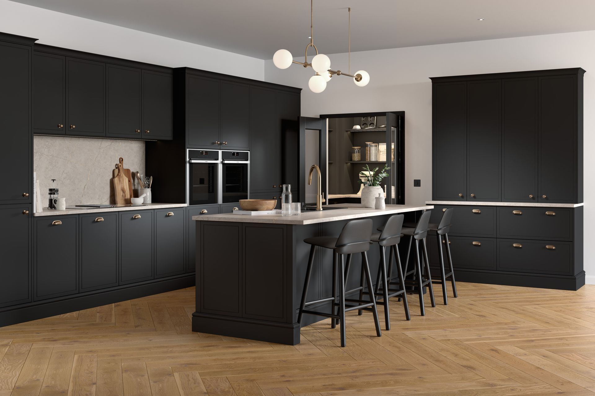 A modern kitchen with matte black cabinets, light stone countertops, an island with bar stools, and herringbone flooring.