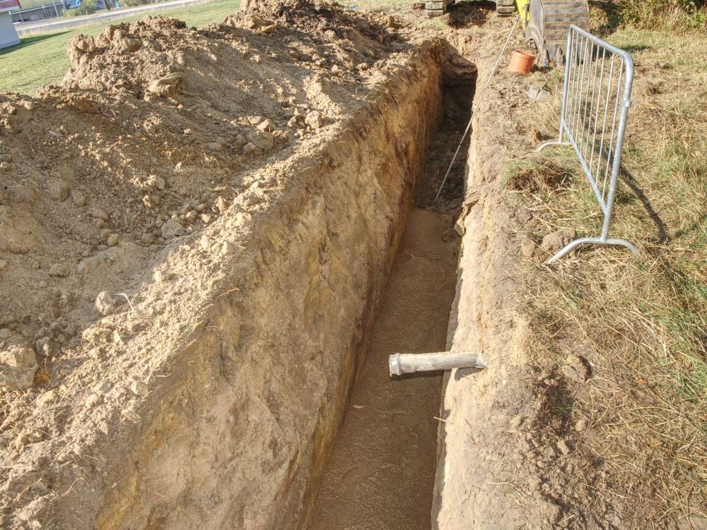 A Land Is Excavated for The Underground Pipeline — Tim Larkin Plumbing and Excavations in Wauchope, NSW