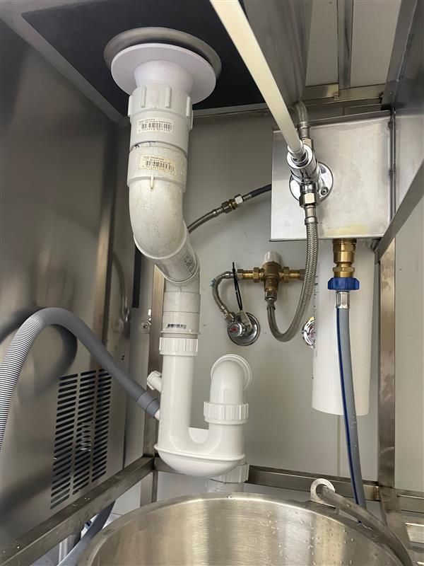 New Plumbing Installation Under a Sink — Tim Larkin Plumbing and Excavations in Laurieton, NSW