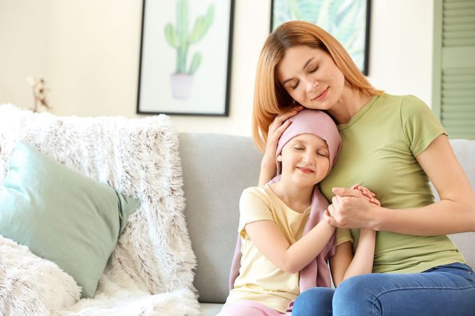 Mother caregiver helping daughter