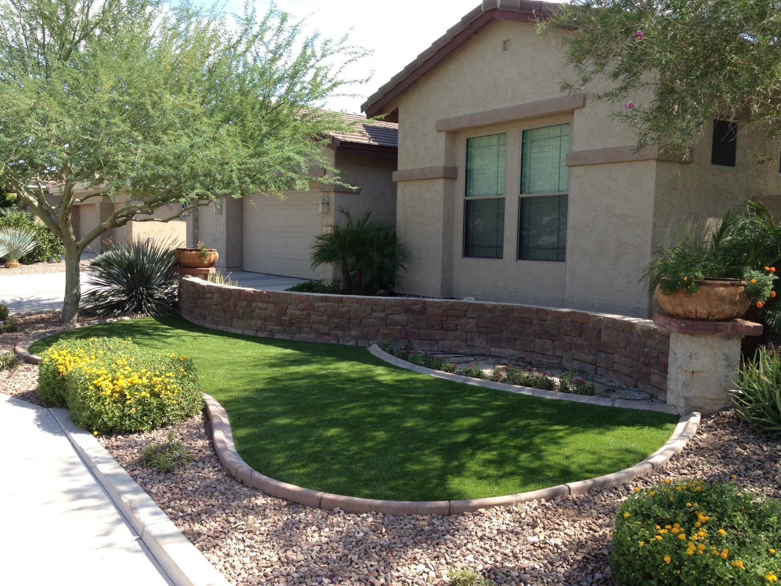 The owner of this property in Tempe, AZ has surely taken advantage of artificial grass in making their landscape aesthetically pleasing.