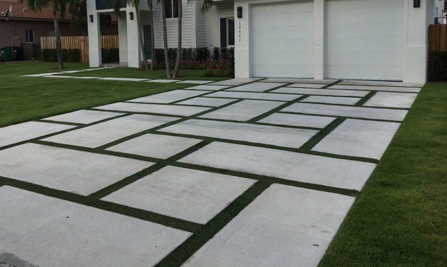 Pavers and fake grass installation project in Chandler, AZ, with the artificial turf between the pavers.