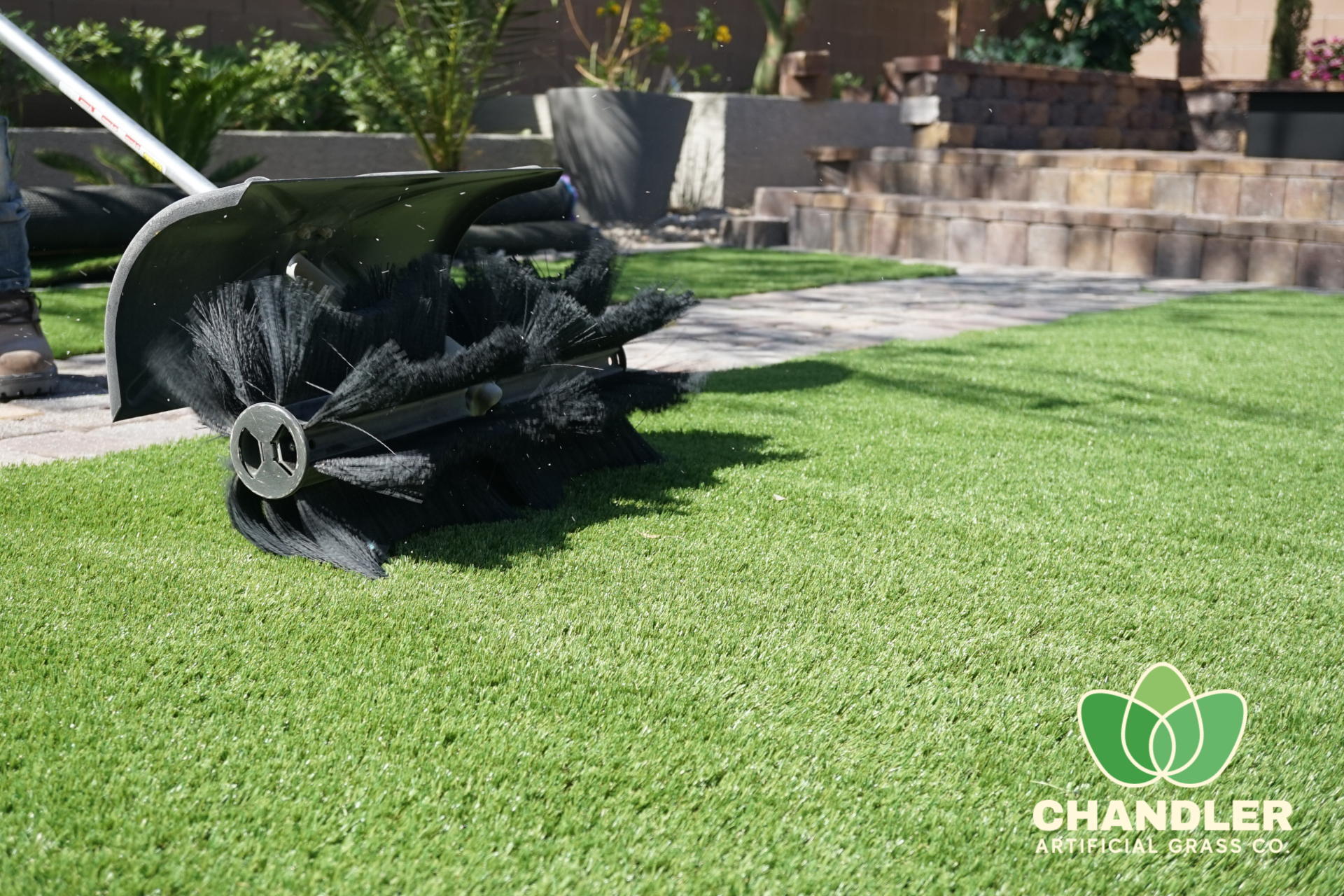 chandler artificial grass contractor power brooming a fresh turf install