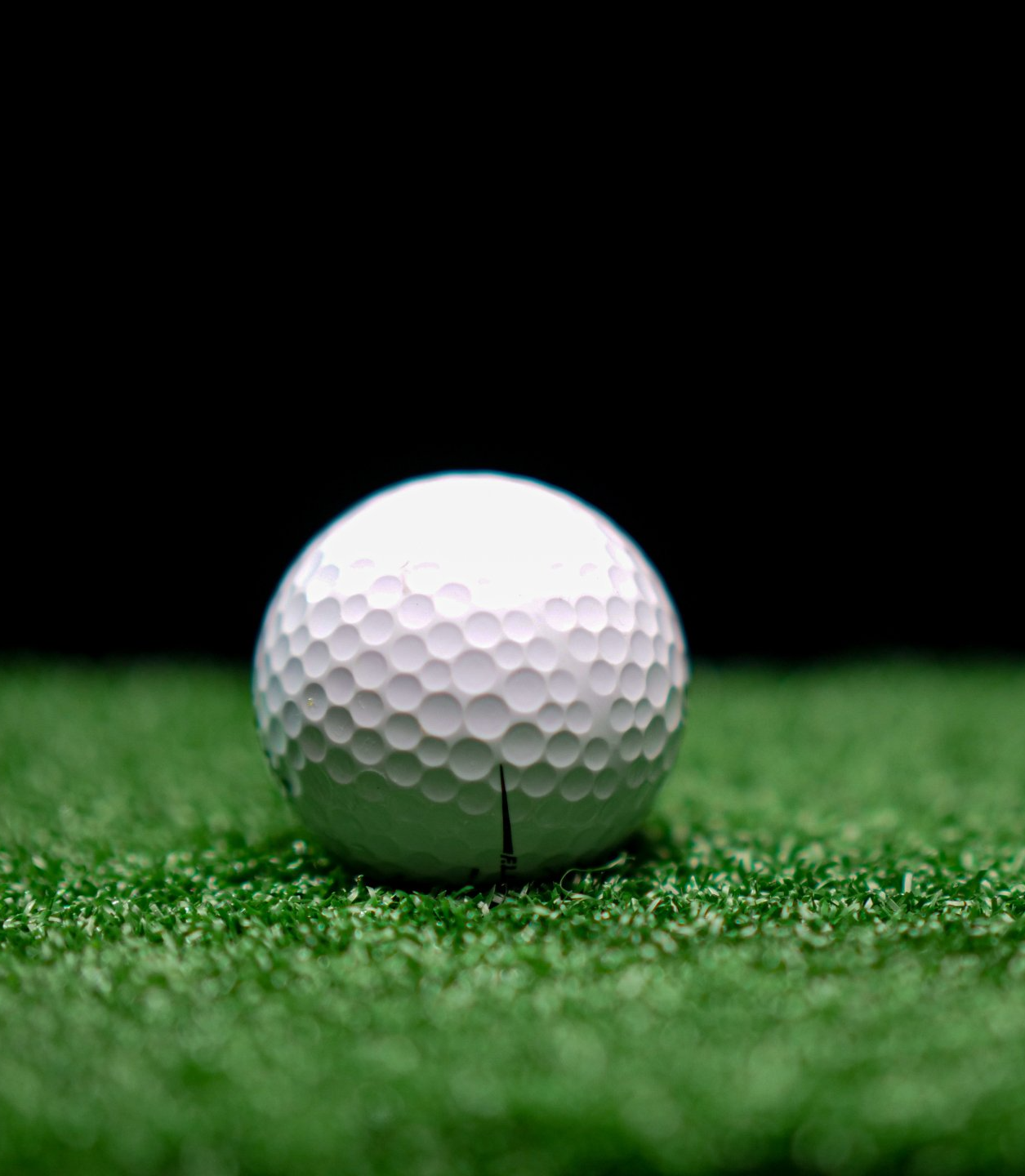 Freshly installed artificial turf golf green in Chandler AZ. Close up shot of golf ball.