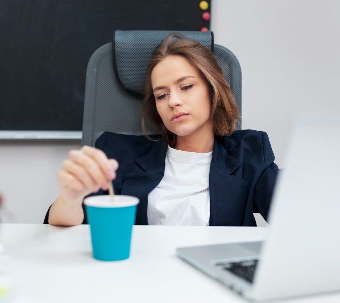 Woman looking bored at her work