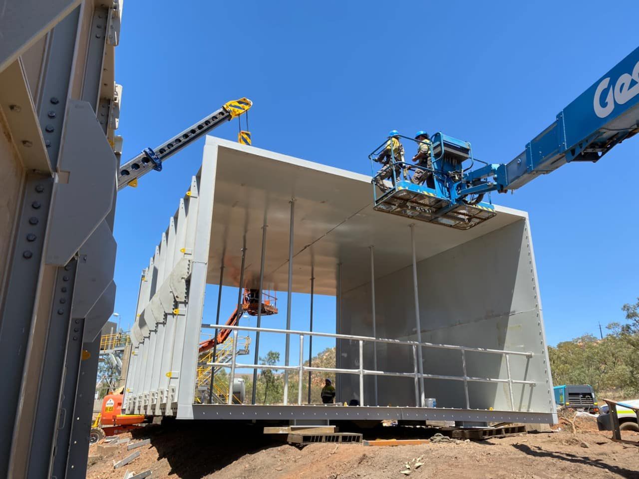 Crane Lifting A Large Concrete Structure On A Construction Site — Calibre Engineering In Mica Creak, QLD