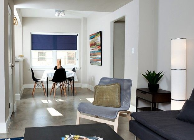 A living room with a table and chairs and a couch