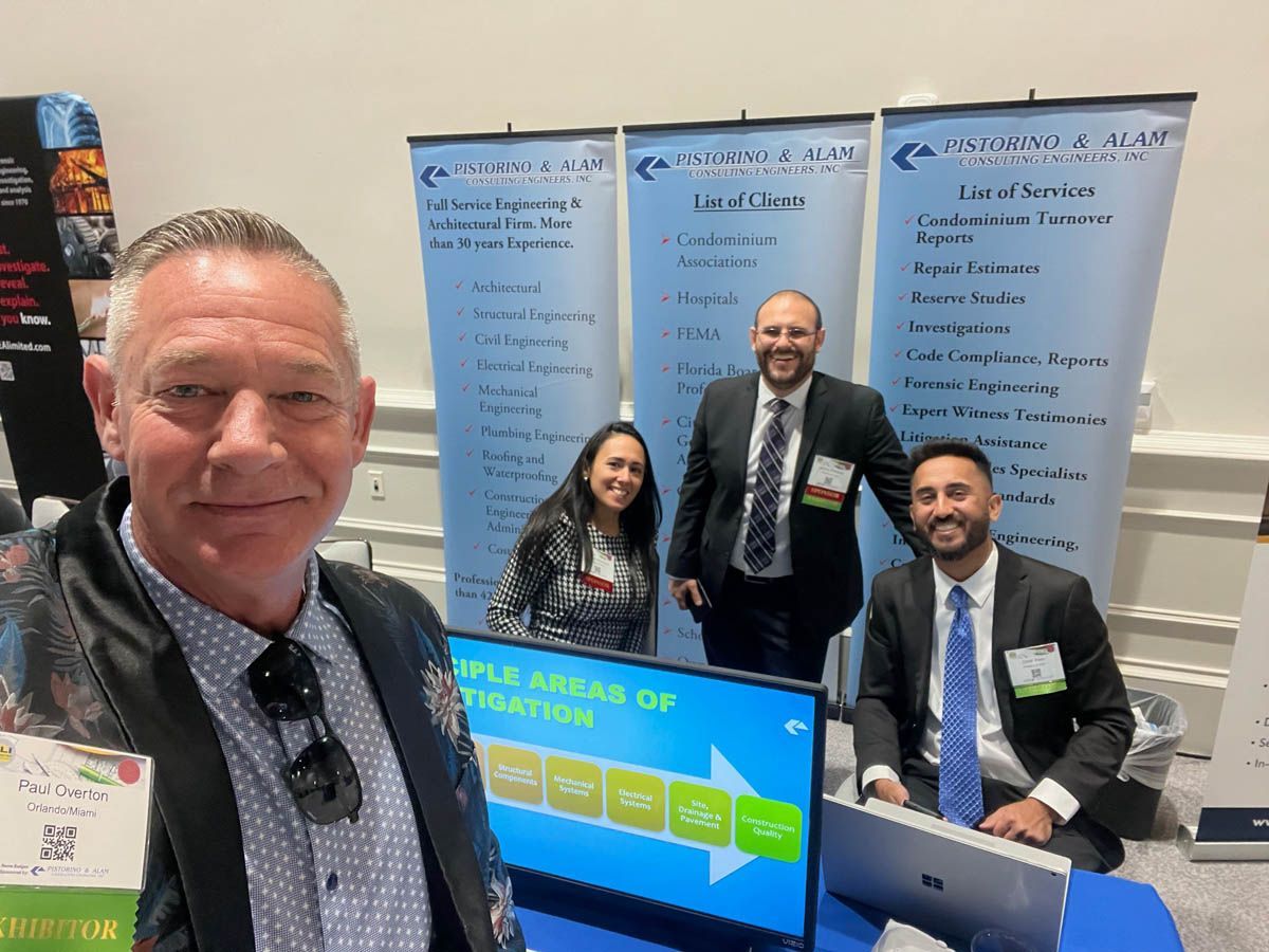 A group of people are posing for a picture at a job fair.