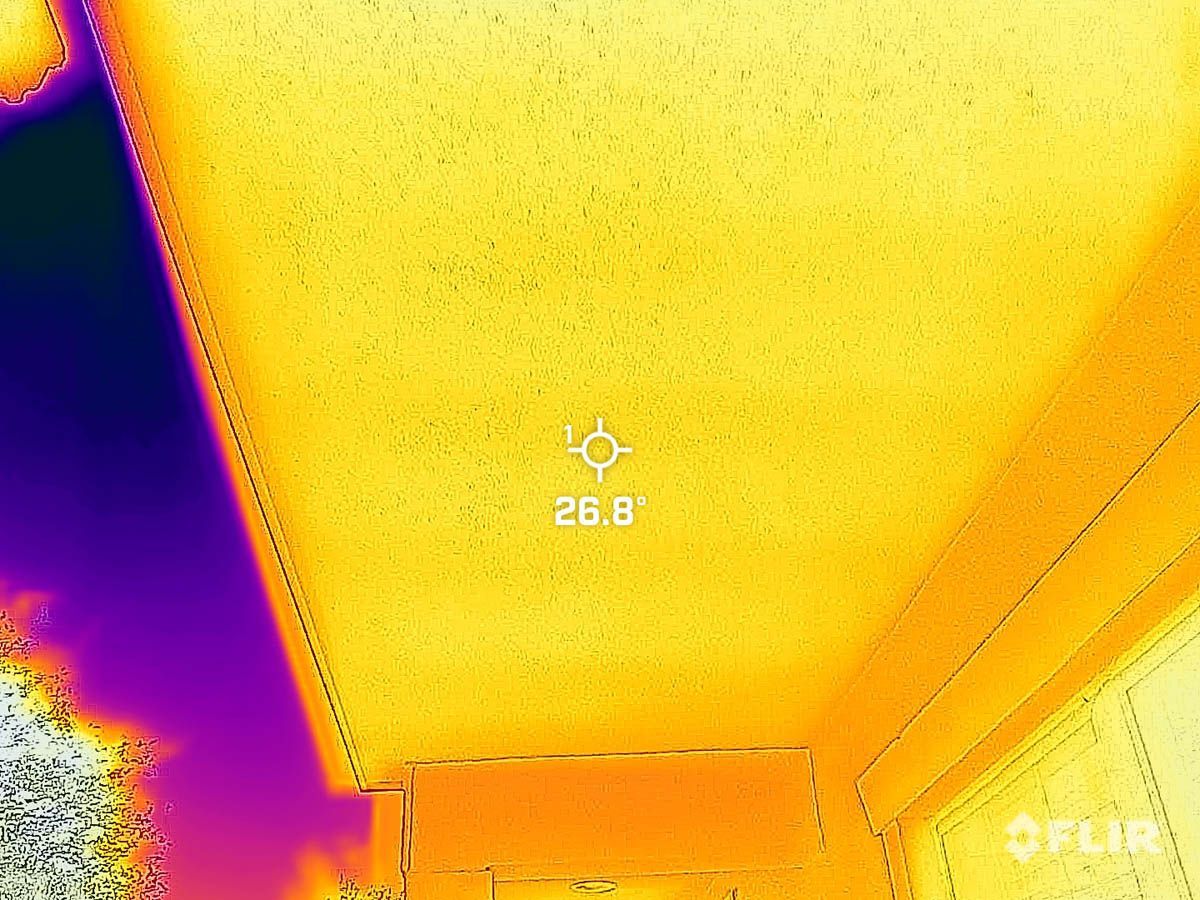 A thermal image of a room with a ceiling that is very hot.