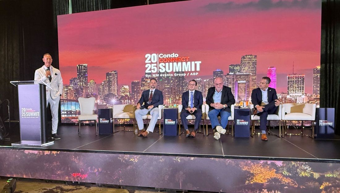 A group of people are sitting at tables in a room.