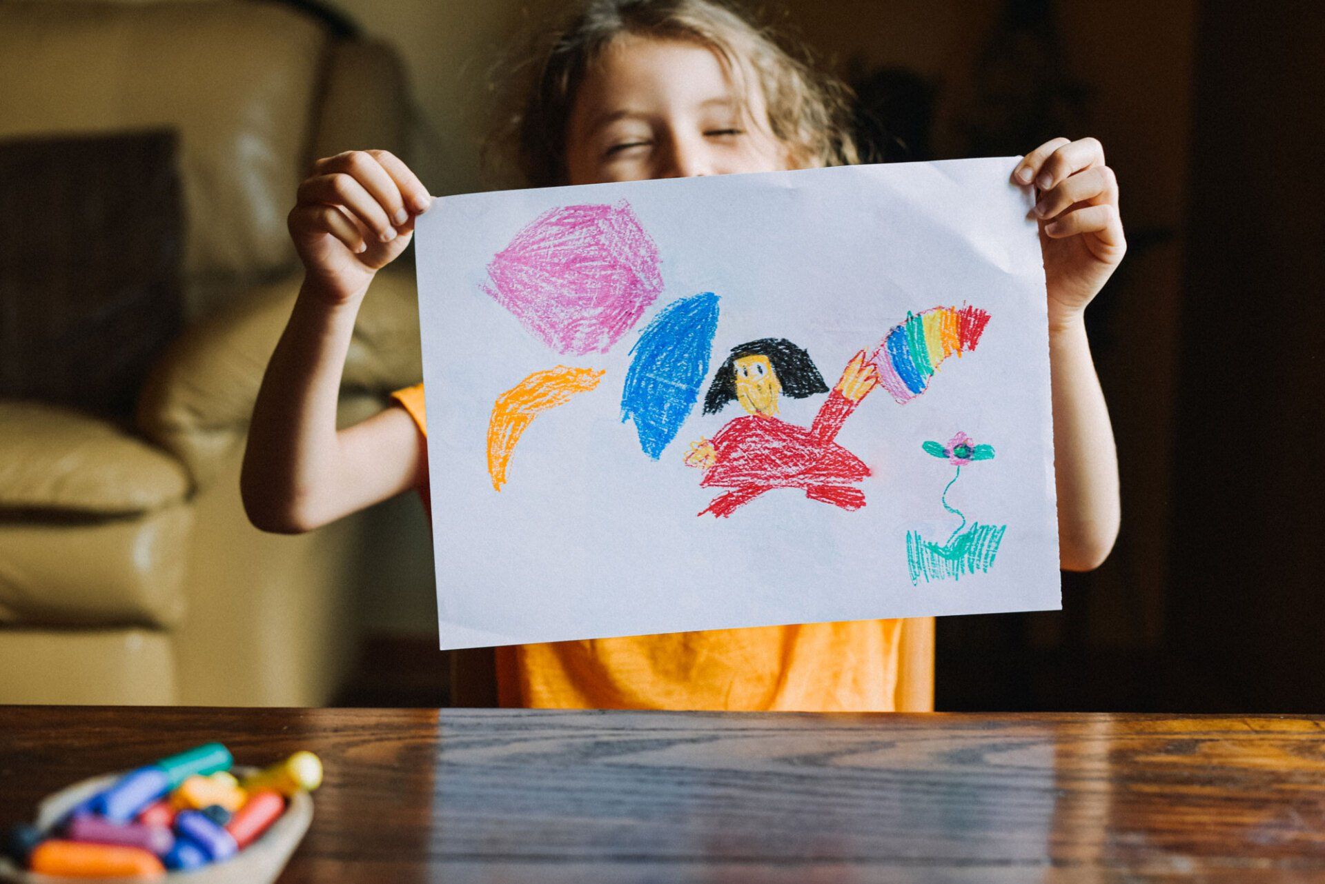 Little Girl Holding Her Artwork — Indianapolis, IN — Riviera Children's Center Inc