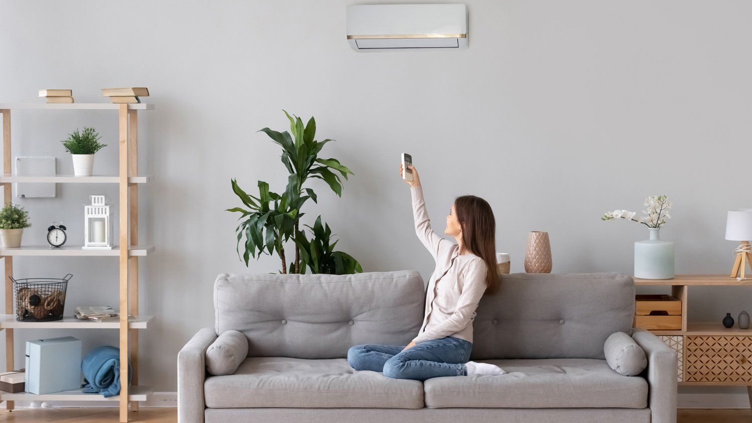 Lady Adjusting Air Conditioning — Napa, CA — CSA Roofing, Heating & Air