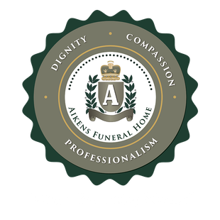 Logo for Aikens Funeral Home: Seal with crown, leaves, and text: dignity, compassion, professionalism.