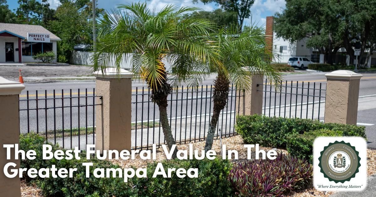 Exterior view of a funeral home with palm trees and a sign: "The Best Funeral Value In The Greater Tampa Area."