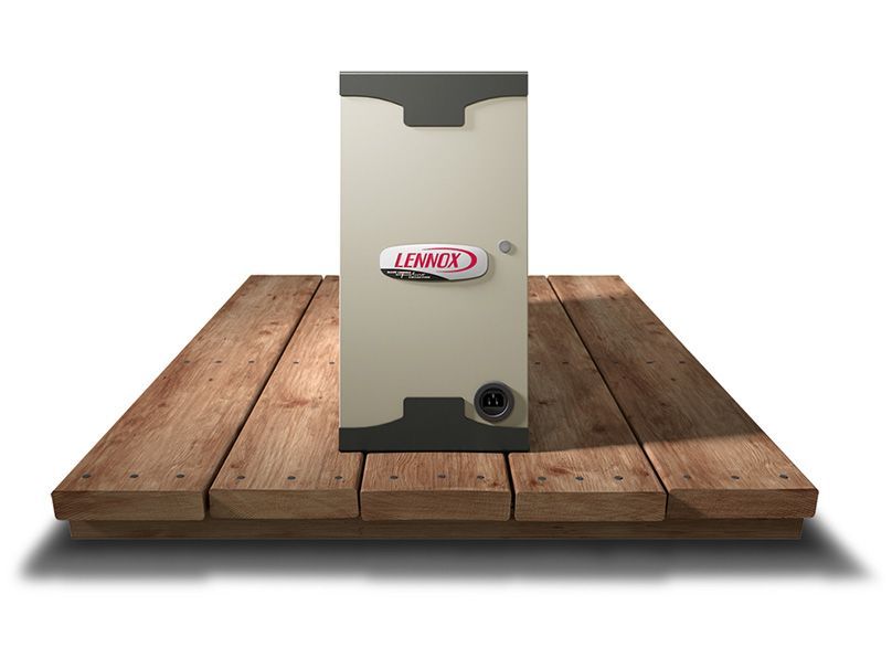 A lennox air conditioner is sitting on a wooden floor.
