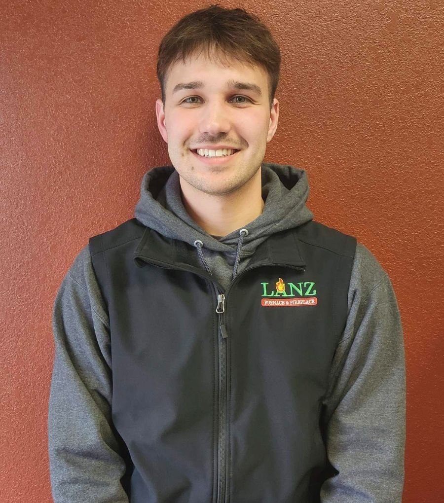 A man wearing a black vest with the word lanz on it