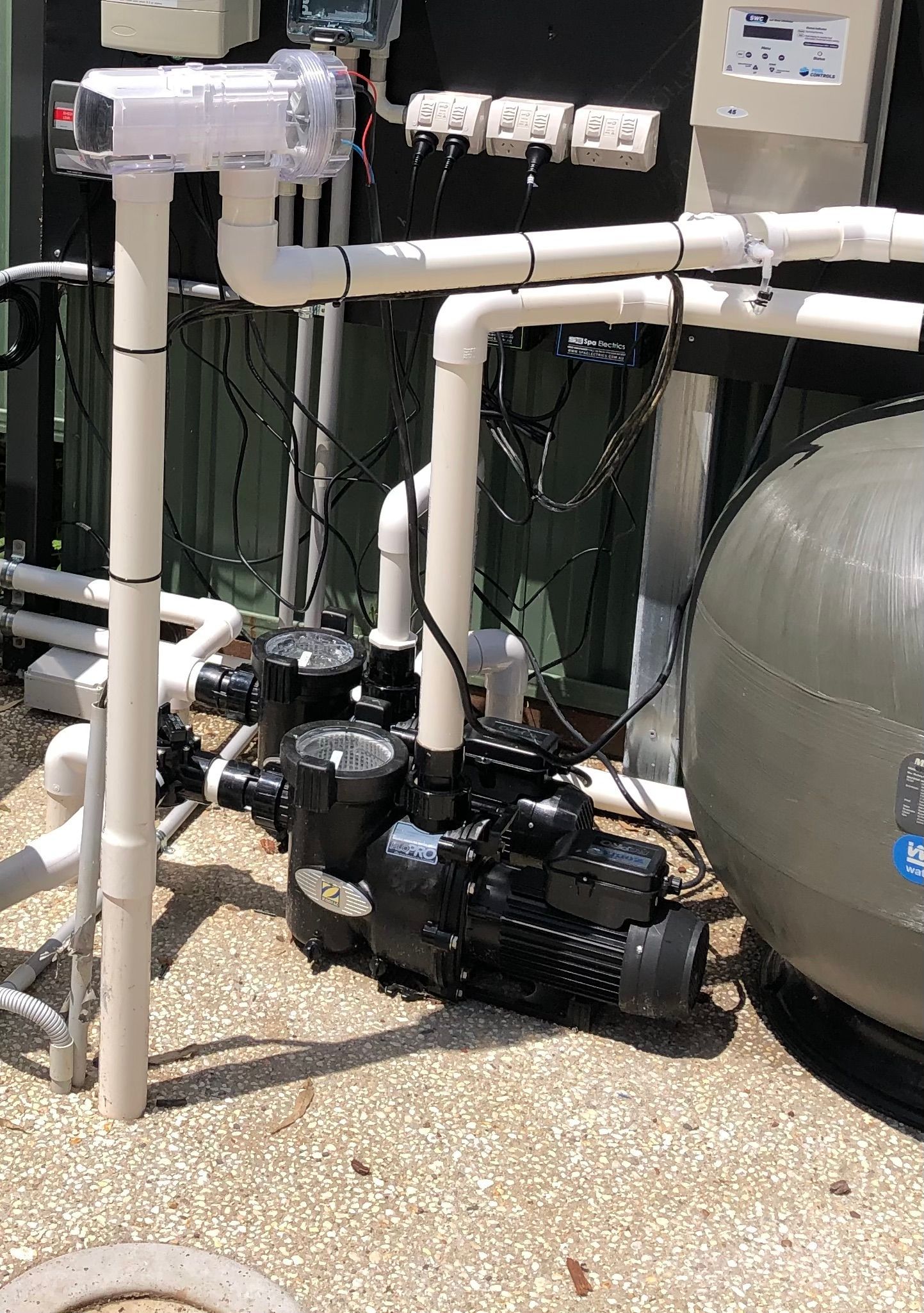 A large pool pump on the concrete — Mediterranean Custom Pools In Kialla, VIC