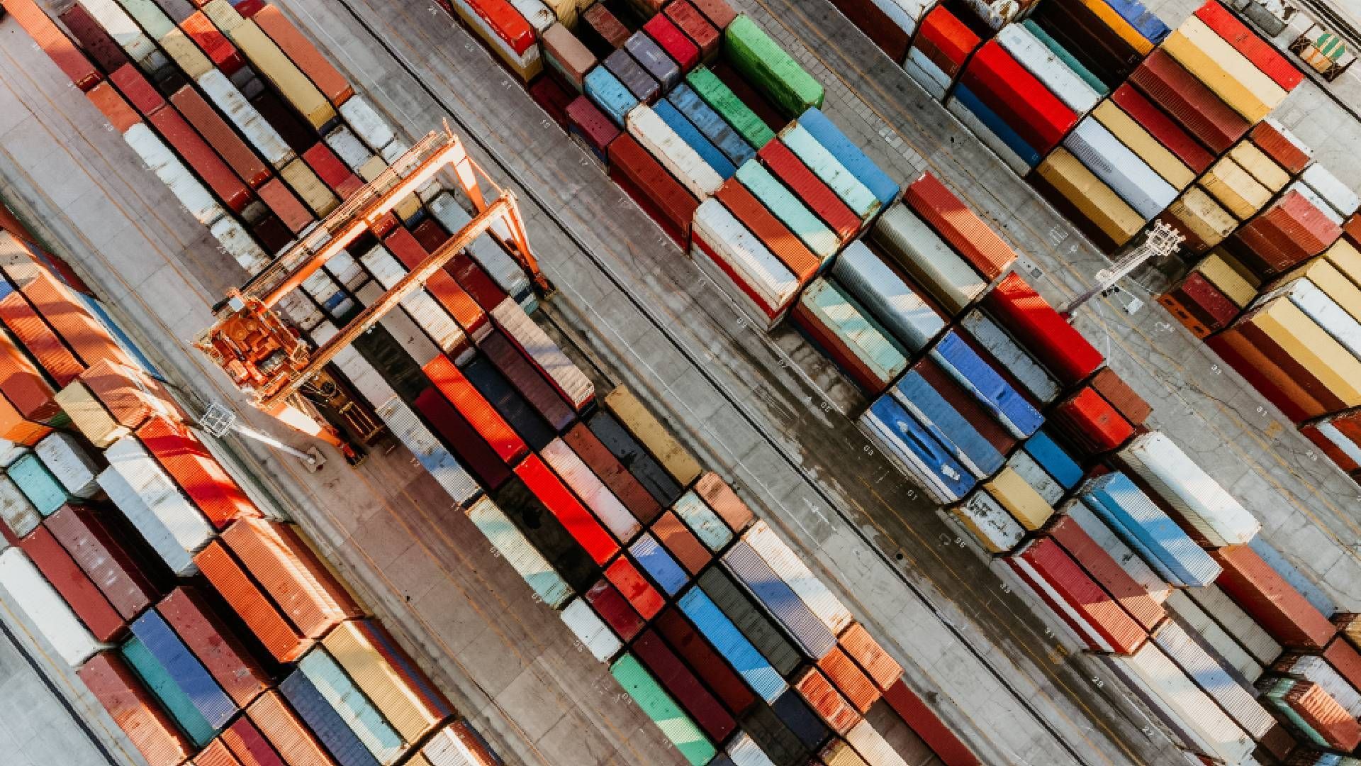Aerial view of freight yard full of multicolored cargo containers