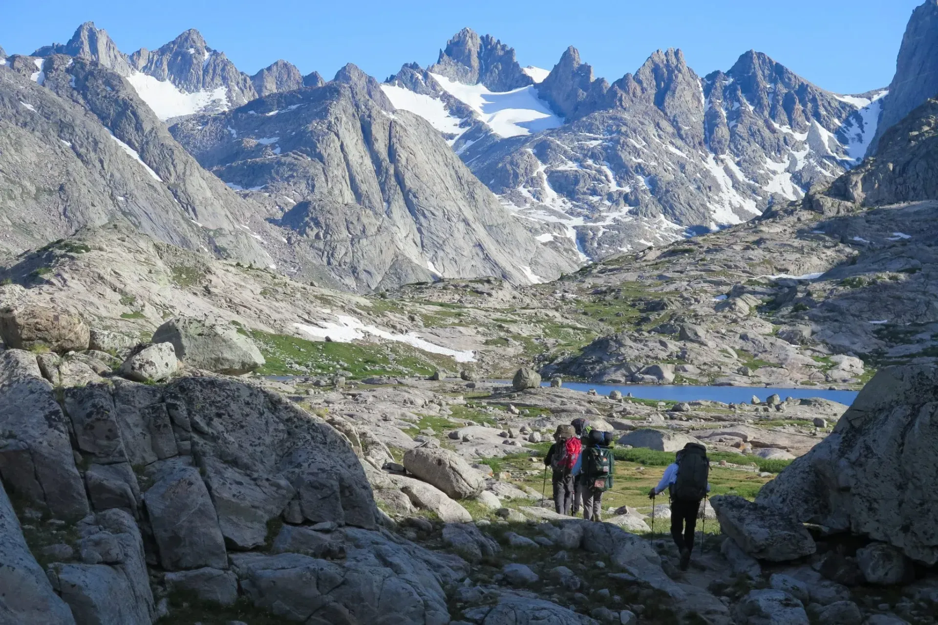 A group of people are hiking in the mountains