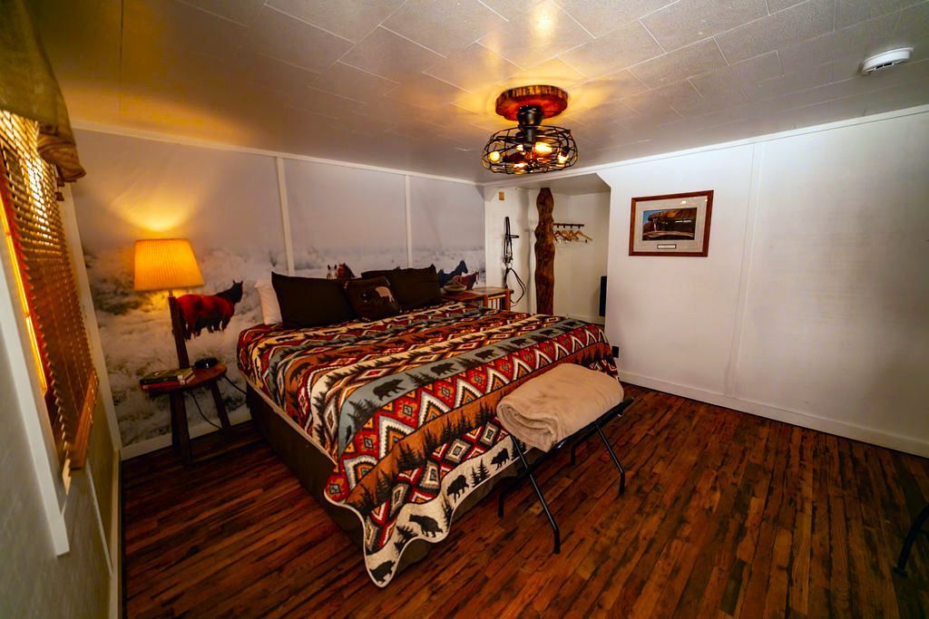 There is a large bed in the middle of the room.