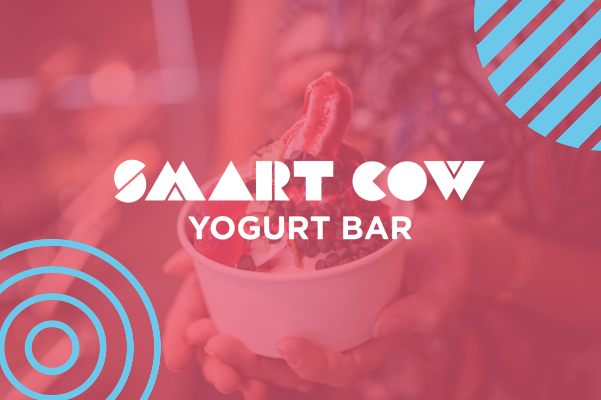 A person is holding a bowl of yogurt in their hands.