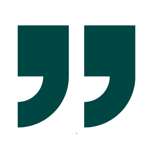 A green quotation mark on a white background.