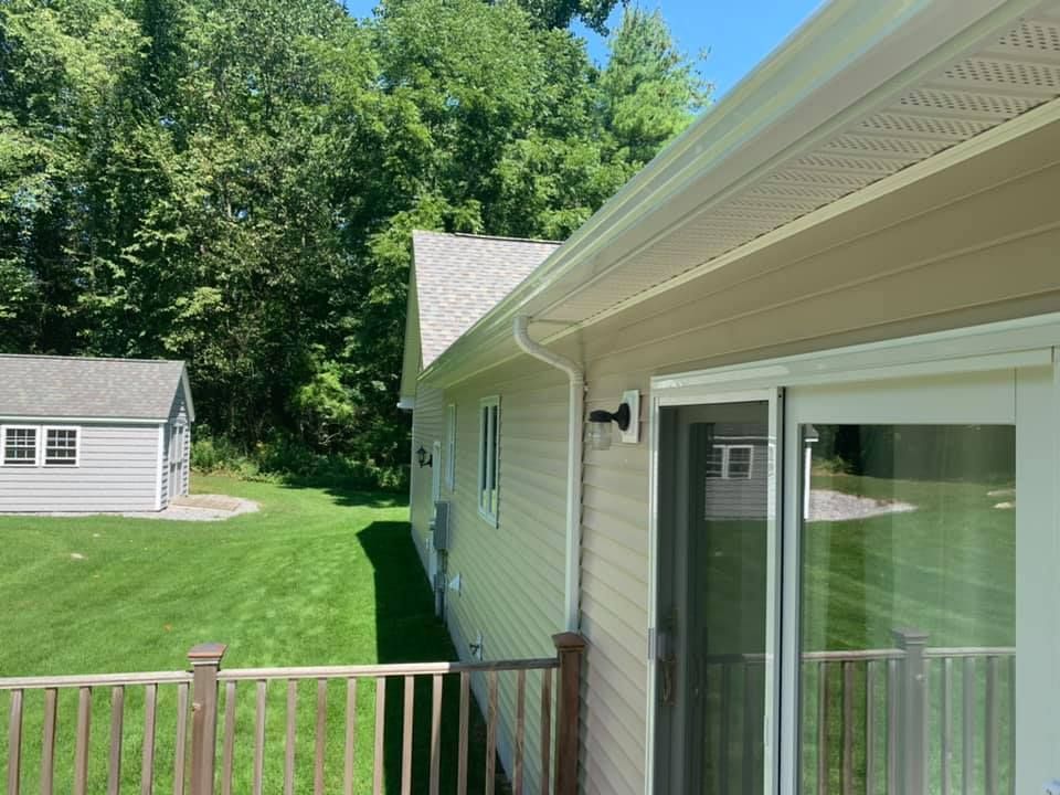 A house with a sliding glass door and a deck