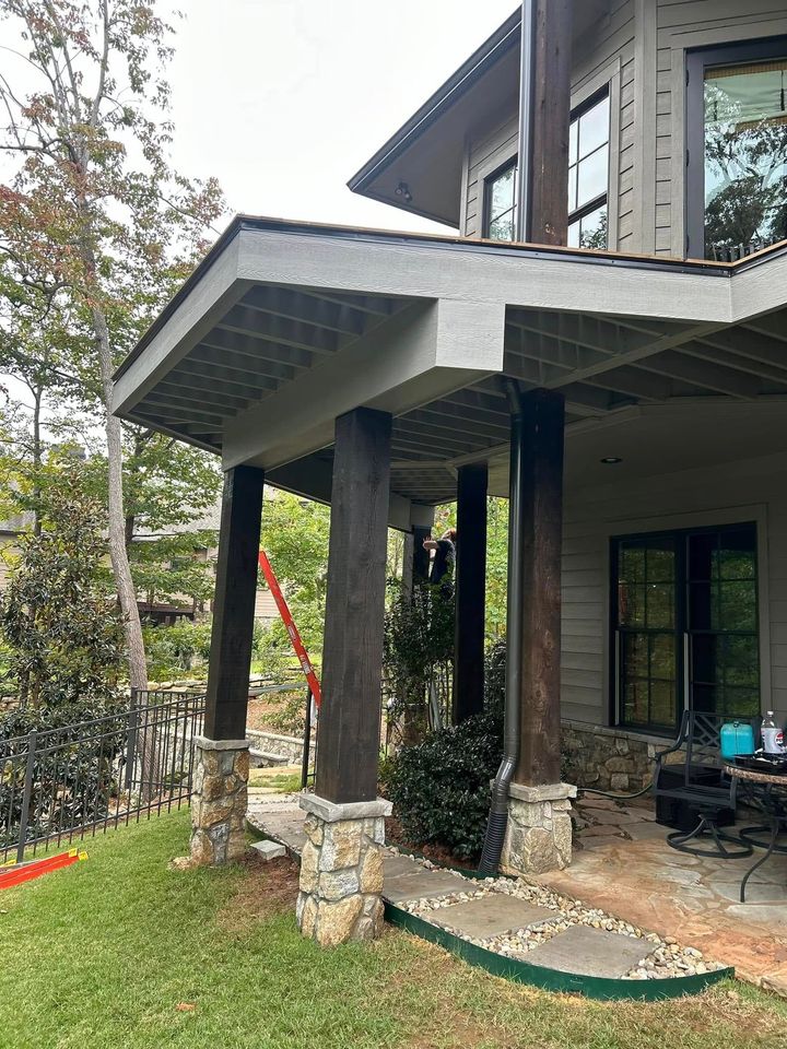 A large house with a porch and a walkway leading to it.