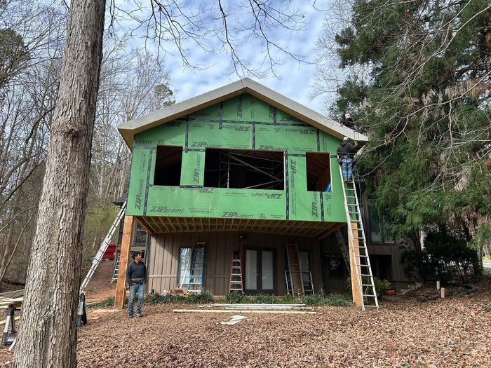 A house is being built in the middle of a forest.