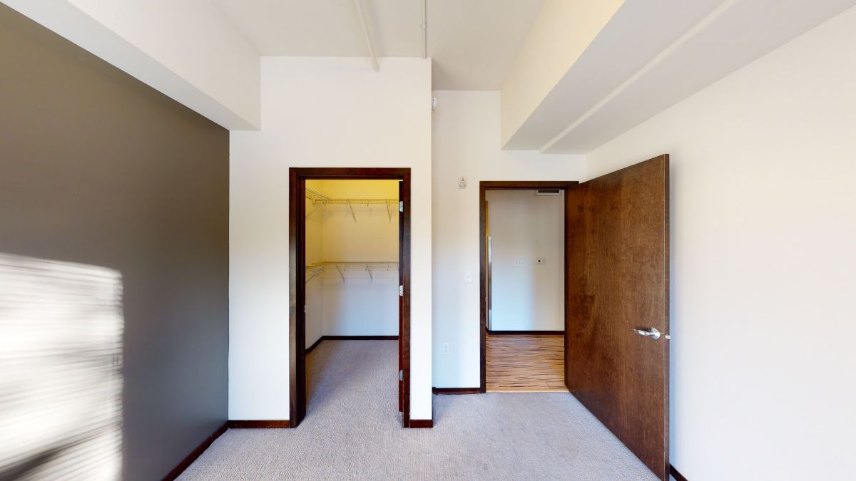 There is a walk in closet in the middle of the room.