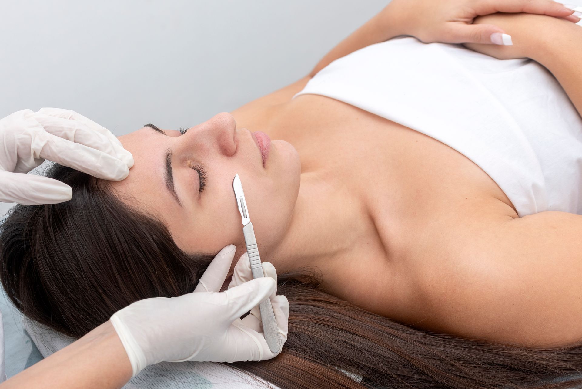 A woman is getting a facial treatment at a spa.