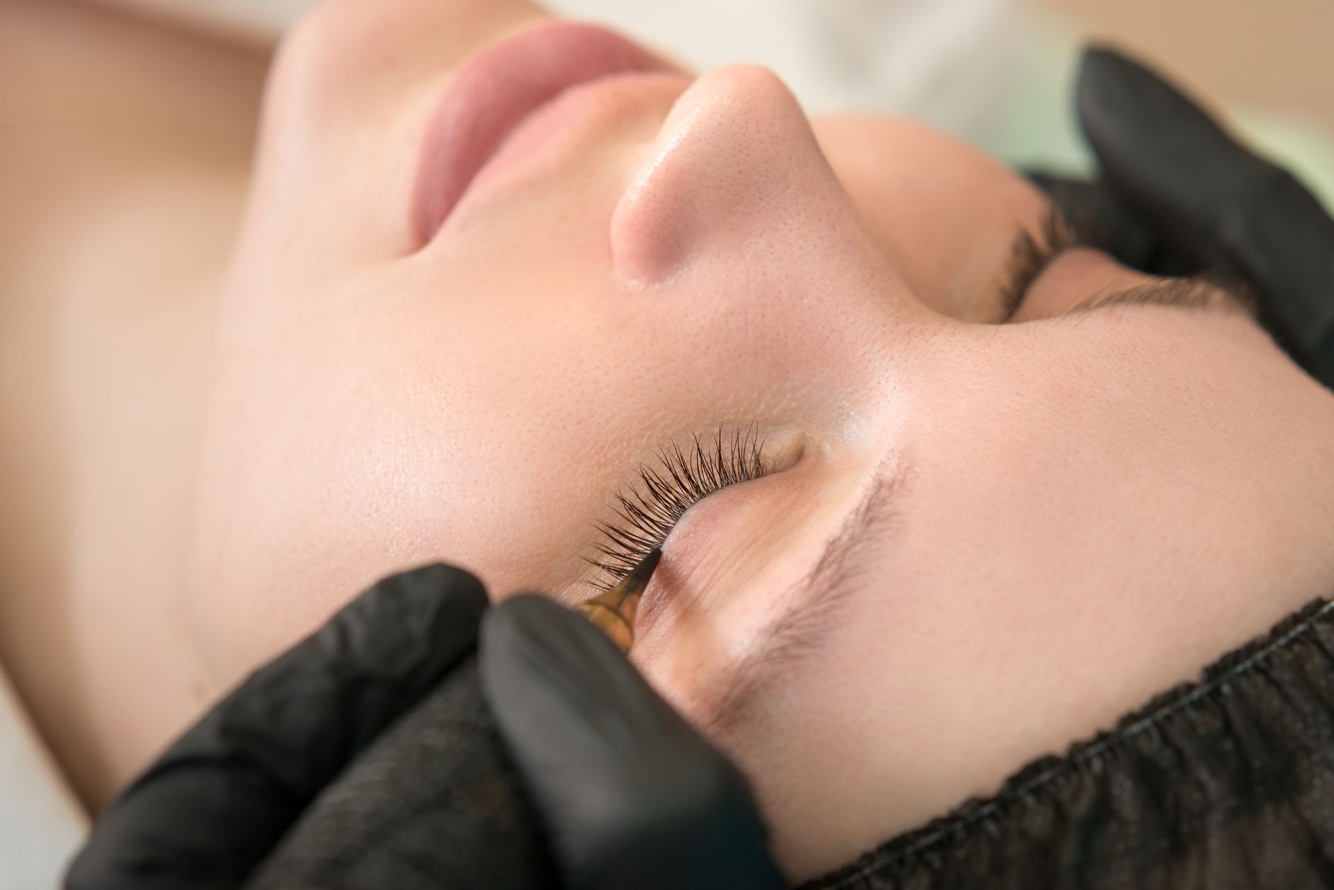 A woman getting an eyeliner treatment